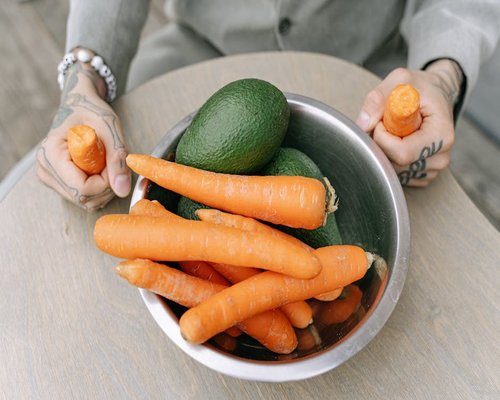 Bowl of fresh healthy vegetables and avocado